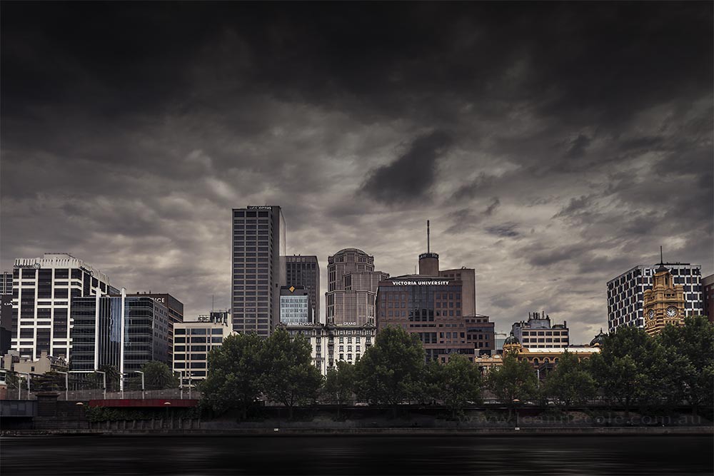 city-skyline-cloudy-moody-river